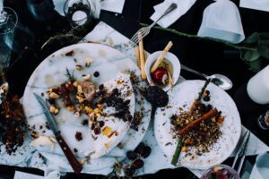 plates with leftover food on table