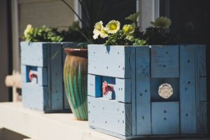 two blue wooden pots